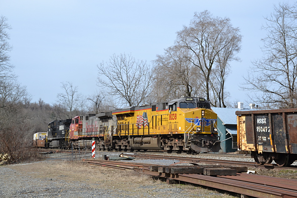 NS 211 led by UP ES44AC #8038, BNSF D9-44CW #682  and NS D9-44CW #9639 east by Linden, Va on 2/21/2017.