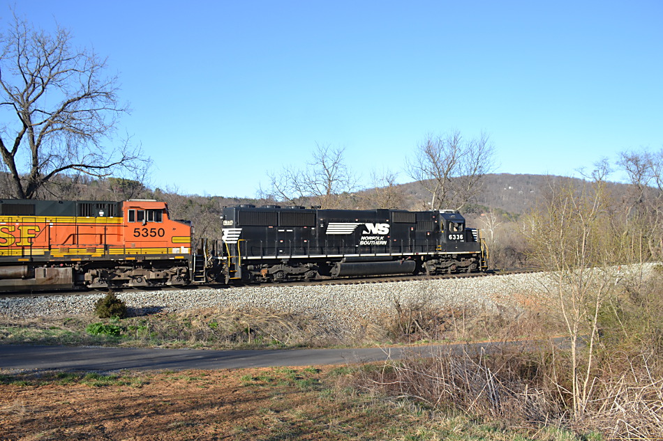 Norfolk Southern train 211 was led by NS SD40E #6336 with BNSF power trailing near Linden, VA on 4/3/2019.