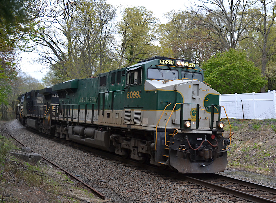 NS train 214 is led by ES44AC #8099 (the Southern Railway heritage unit) west across Rectortown Road in Marshall, Virginia on 4/25/2020.