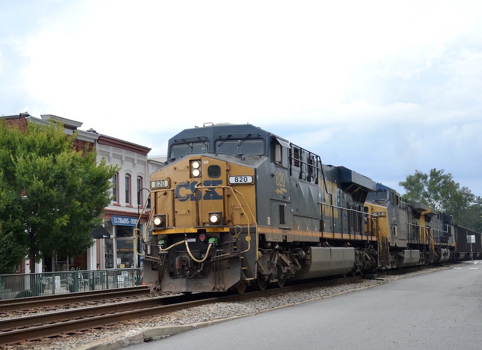 Southbound CSX hopper train led by ES44AH #820 passing through Ashland, Virginia on August 22, 2021