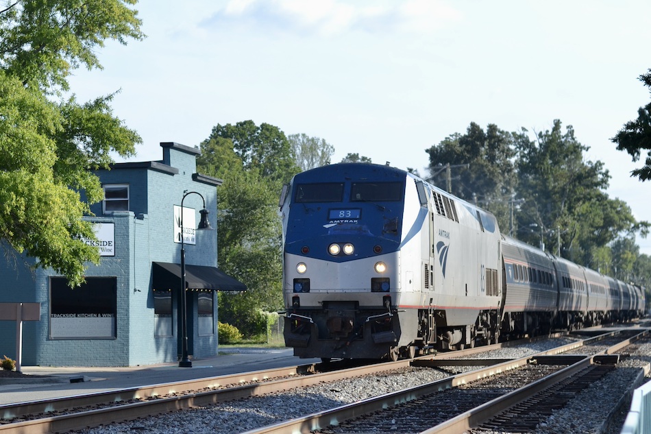 Amtrak train running through a Virginia town