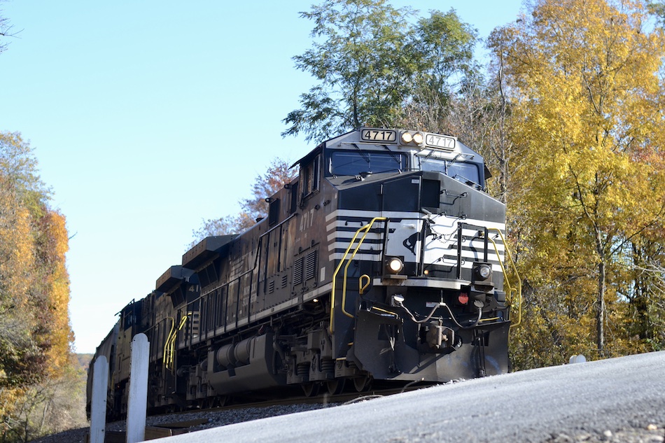 Norfolk Southern freight train rolls past fall foliage