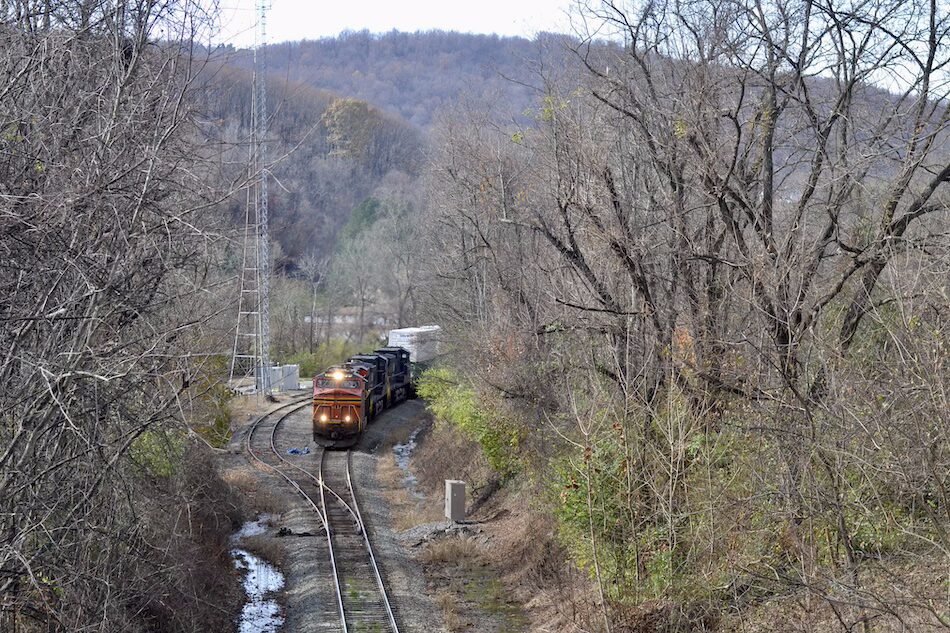 A specially painted Norfolk Southern heritage unit leads an intermodal train through the mountains at Linden, Virginia along the scenic NS B-Line.